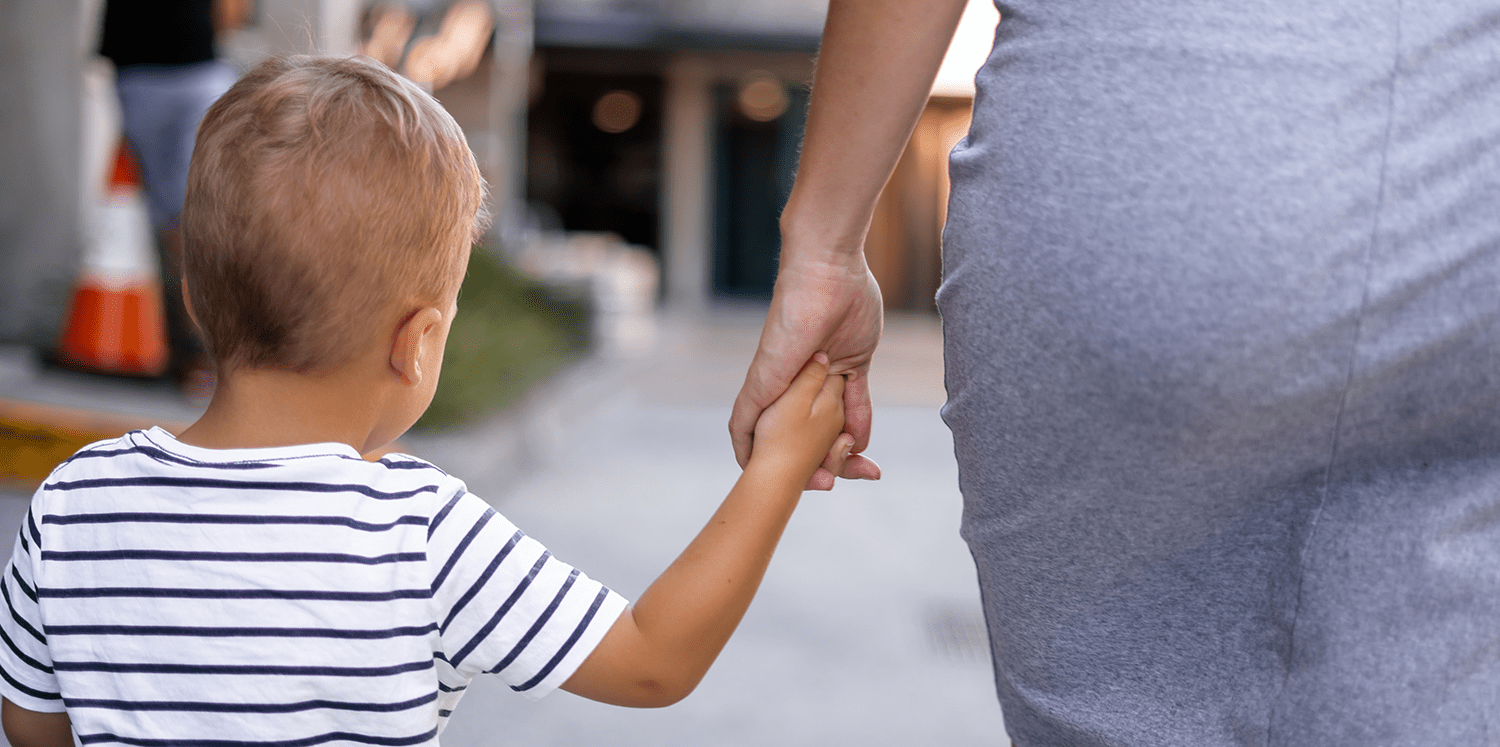 boy-in-striped-shirt-holding-mother's-hand