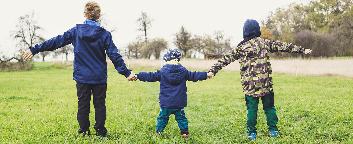 three-boys-holding-each-other's-hands